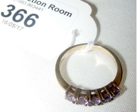 A five stone amethyst ring in 9ct gold setting