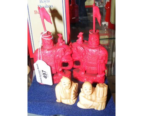 Pair of antique red stained carved ivory Elephant chess pieces - 12cm high, together with two Netsukes