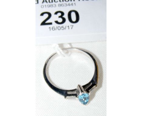 A blue topaz and diamond ring in 9ct white gold setting