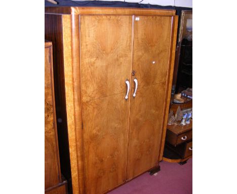 A 1920's classic Art Deco walnut two door wardrobe with faux shell ivory handles - 120cm