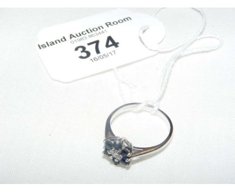 A sapphire and diamond ring in 9ct white gold setting