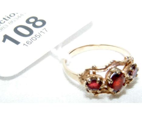 A garnet ring in 9ct gold setting