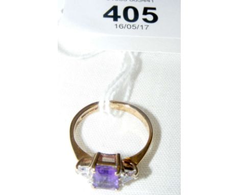 An amethyst and white stone ring in 9ct gold setting