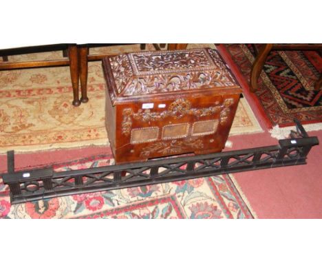 An antique French enamel stove, together with pierced metal fire fender