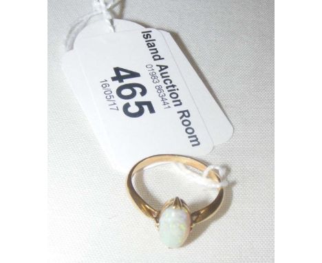 A single stone opal dress ring in 18ct gold setting