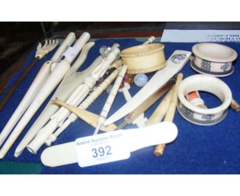 Assorted ivory glove stretchers, napkin rings