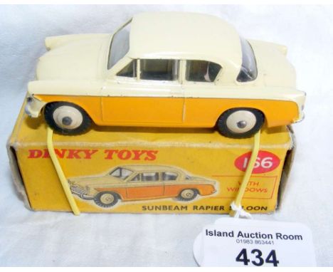 A boxed Dinky Toys No.166 Sunbeam Rapier Saloon in yellow and cream