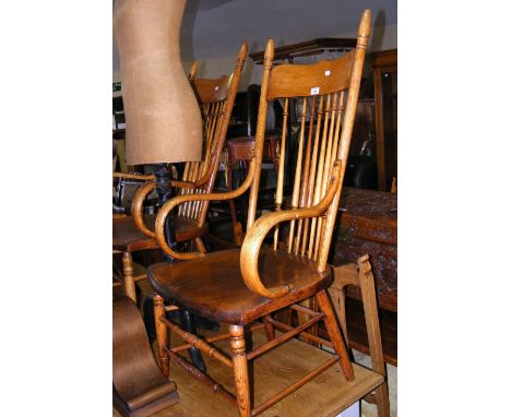 A pair of American antique stick back armchairs