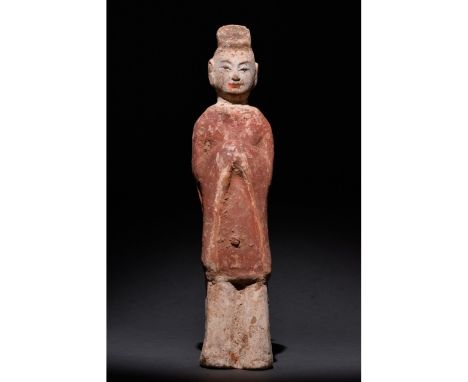 C. 500 AD. Chinese Northern Wei Dynasty. An elaborately crafted male attendant figure dressed in a rich red tunic and light b