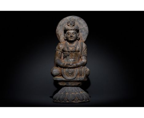 100-300 AD. Gandharan. Schist figure of a two- faced Buddha atop a lotus. Buddha, backed by a halo, gazing serenely into the 