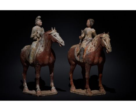 C. AD 618-907. Tang Dynasty. A pair of finely rendered Tang Dynasty terracotta moulded figurines depicting a male and female 