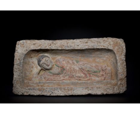 C. 386-534 AD. Northern Wei Dynasty. A painted brick featuring a reclining Buddha figure placed within a rectangular recess. 