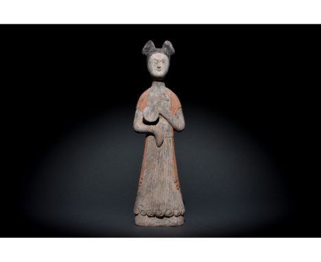 C. AD 618 and 907. Tang Dynasty. A delicate Tang Dynasty lady wearing long flowing gowns with overlength sleeves which hide h