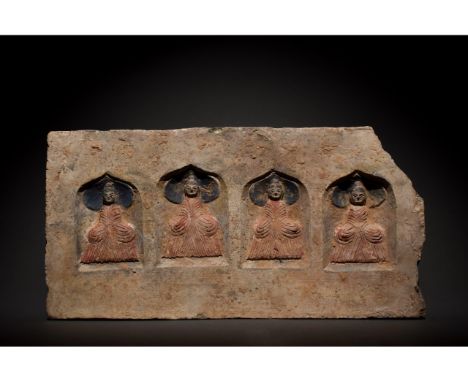 C. 386-534 AD. Northern Wei Dynasty. A brick featuring four painted Buddhas within an arched recess. All four Buddhas are wea