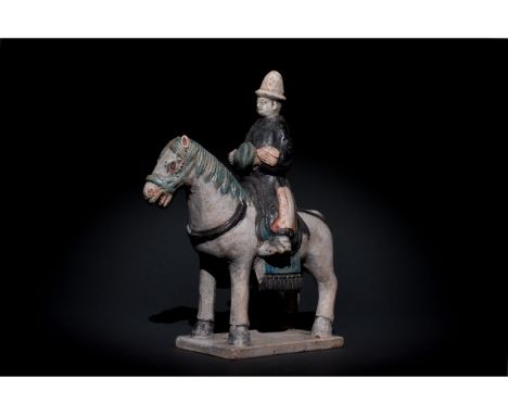 Ca. 1368-1644 AD. Ming Dynasty. Ceramic Horse with Rider. An elegant ceramic figurine depicting a grey horse in a standing po