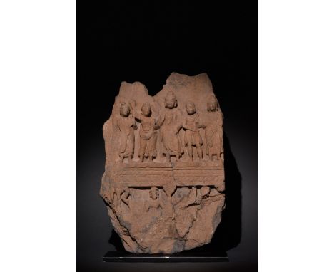100-300 AD. Gandharan. A grey-brown schist relief panel bearing Buddhist scenes arranged over two register. Upper register: B
