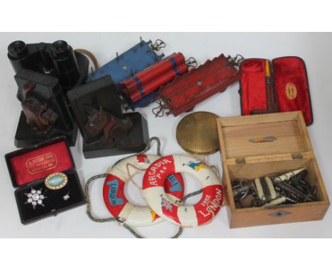 A mixed lot including a pair of wooden cat and dog book ends, a pair of miniature model lifebelts, a vintage pipe, three piec