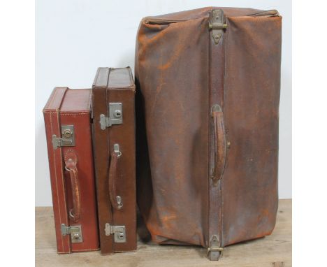 A vintage leather Gladstone type bag and two vintage leather cases. 