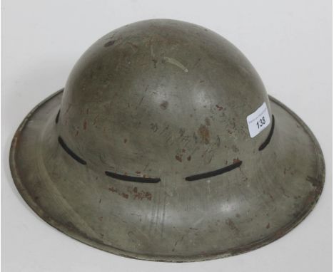 British WWII Brodie helmet stamped 'M' to rim and 'AMC 3/1941' to udnerside, with liner. 