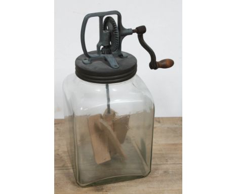 A vintage butter churn pressed glass marked '6 Imperial Quarts Blow butter Churn 60 Made In England'. 