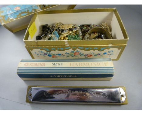 Box of costume jewellery containing mostly bead necklaces, an enamel pendant on Chain A/F and a Harmonica