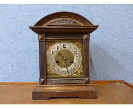 A 19th Century German beech mantel clock