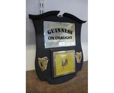 A reproduction Guinness advertising barometer