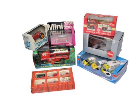 A group of boxed die-cast models including examples by Corgi, Bburago, Siku, and others. Contents feature a London Fire Briga