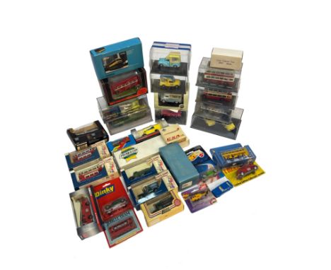 A group of boxed die-cast model vehicles, including buses, commercials, vans, and ice cream trucks. Manufacturers include Cor
