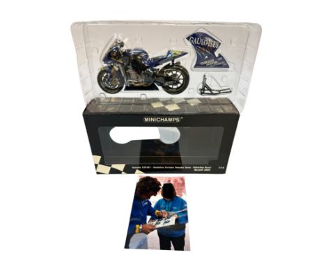 A Minichamps 1:12 scale die-cast model of the Yamaha YZR-M1 as raced by Valentino Rossi for the Gauloises Fortuna Yamaha Team
