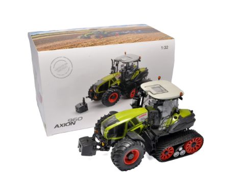 Wiking 1/32 farm model issue comprising Claas Axion 960 Tractor. Tracked Edition. Displayed but no obvious sign of fault. In 
