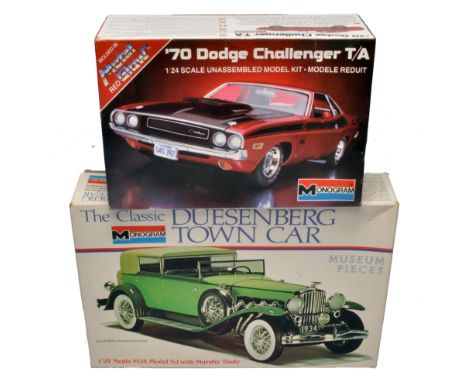 A duo of Monogram 1/24 scale model kits, comprising a '70 Dodge Challenger T/A and a 1934 Duesenberg SJ Town Car. Both are un