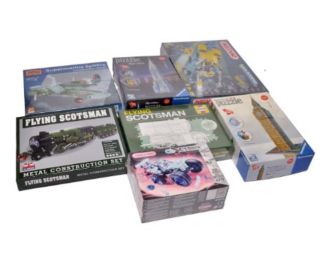 A group of 7 boxed model construction sets and puzzles, including a Flying Scotsman metal construction set, a Supermarine Spi