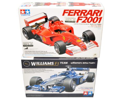 A duo of Tamiya 1:20 scale model kits, comprising Ferrari F2001 and Williams F1 BMW FW24. As New.
