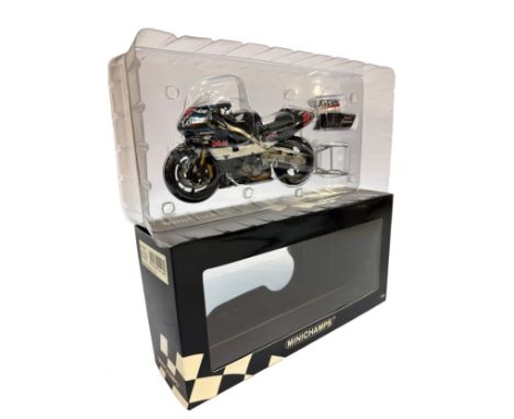 A Minichamps 1:12 scale die-cast model of the Honda RC211V as raced in 2003 by Loris Capirossi. Signed. Box glue failing.