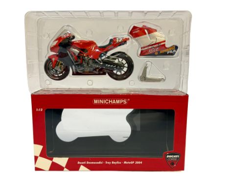 A Minichamps 1:12 scale die-cast model of the Ducati Desmosedici MotoGP bike as ridden by Troy Bayliss in 2004. Signed. Wear 