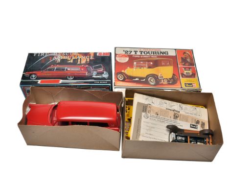 A duo of 1/25 scale plastic car model kits including a Jo-Han Fire Rescue Ambulance and a Revell ’27 T Touring Ford Street Ro