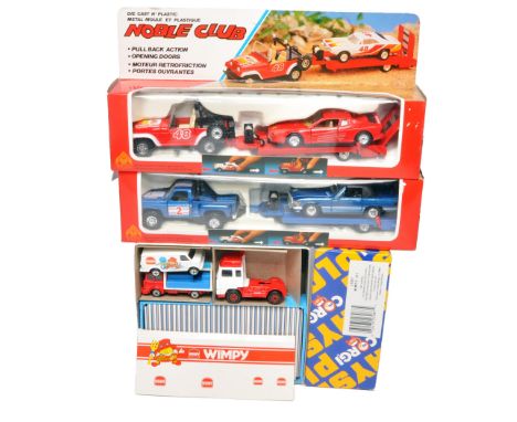 A group of mixed die-cast and plastic vehicle sets, including two Noble Club car transporter sets with pull-back action and o