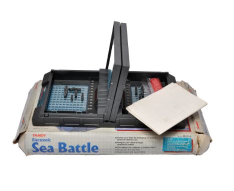 Vintage Tandy Electronic Sea Battle game, complete with the original box, ships, pegs, and instruction sheet.