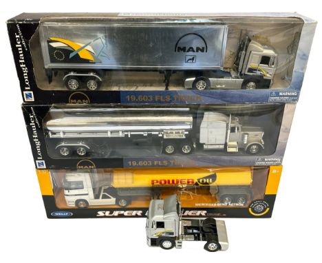 A group of four plastic /die-cast model trucks including two Long Hauler MAN 19.603 FLS trucks (one box marked as such, the s