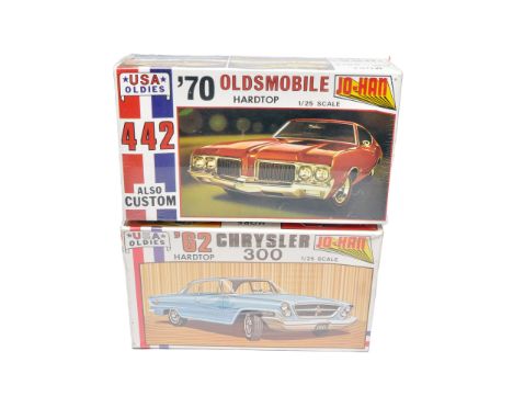 A duo of Jo-Han USA Oldies 1/25 scale plastic car kits, comprising the 1970 Oldsmobile 442 and the 1962 Chrysler 300 hardtop.
