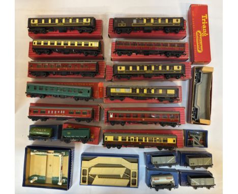 A group of boxed Hornby-Dublo and Tri-ang model railway items, including various wagons, coaches, and accessories. Highlights