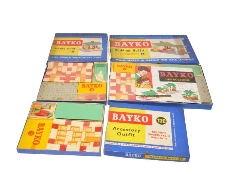 A collection of vintage Bayko construction sets including Building Outfits No. 11 and 12, Accessory Outfit 12C. All unused wi