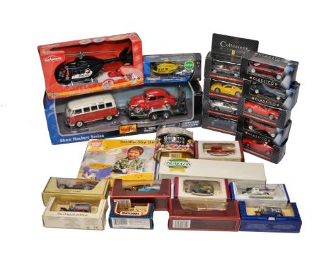 A group of boxed die-cast and promotional model vehicles, including examples from Maisto, Matchbox, Majorette, Corgi, and Cla