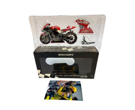 A Minichamps 1:12 scale die-cast model of the Yamaha YZR-M1 as raced by Carlos Checa for the Gauloises Fortuna Yamaha Team in