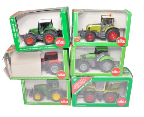 A group of Siku 1/32 farm model issues comprising various tractor models, as shown. Some Boxes with notable storage wear.