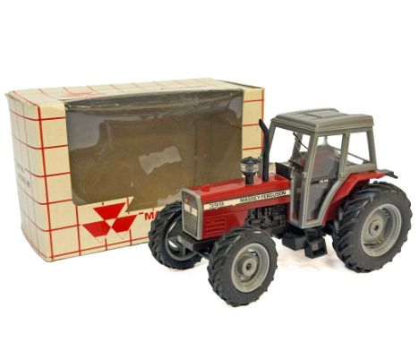 A plastic issue Massey Ferguson 399 Tractor in Massey Ferguson dealer part box. Part no. 3405499 M1. Excellent in very good b