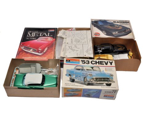 A group of three plastic / metal car model kits in 1/24 scale, including Monogram '56 T-Bird (die-cast and plastic), Monogram