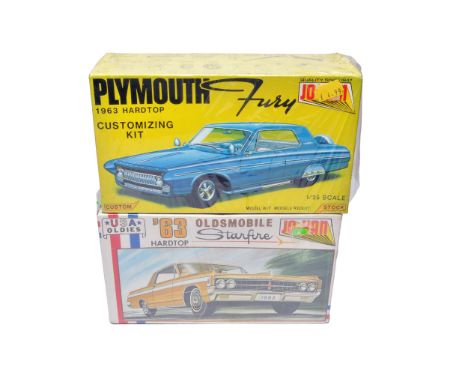 A duo of Jo-Han 1/25 scale plastic car kits, comprising the 1963 Plymouth Fury Hardtop Customizing Kit and the 1963 Oldsmobil