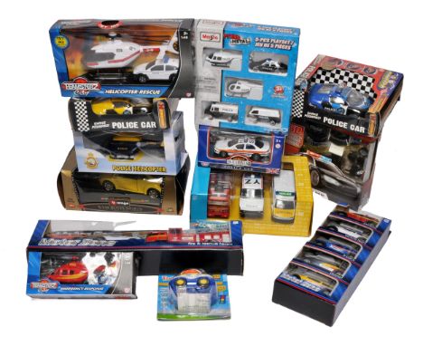 A group of boxed emergency-themed toy vehicles, including police cars, helicopters, fire engines and rescue sets. Brands incl